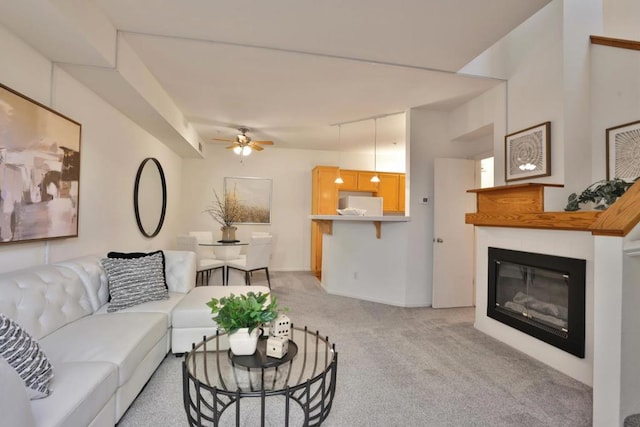 living room featuring ceiling fan and light colored carpet