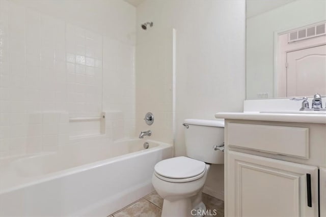 full bathroom featuring washtub / shower combination, tile patterned floors, vanity, and toilet