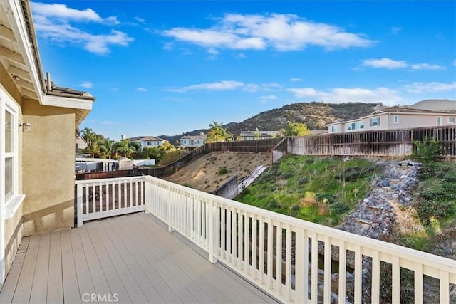 wooden deck featuring a mountain view