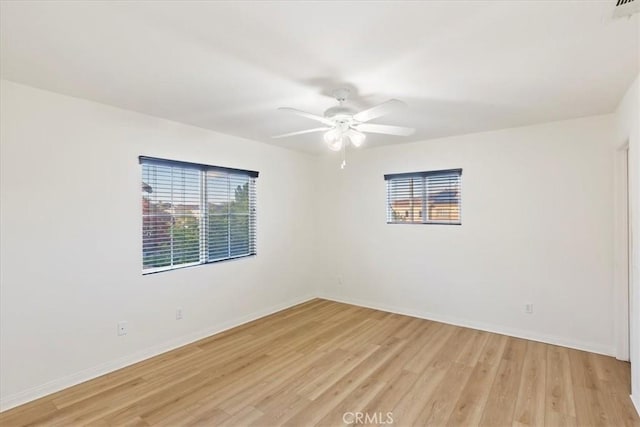 unfurnished room featuring ceiling fan and light wood-type flooring