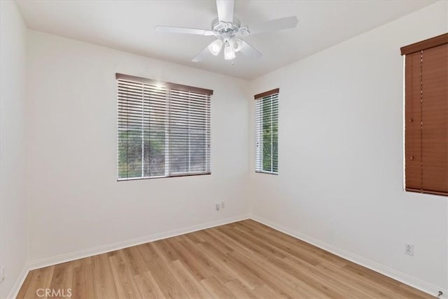 unfurnished room featuring ceiling fan and light wood-type flooring