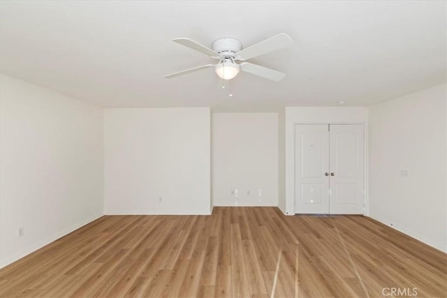 unfurnished room with ceiling fan and light hardwood / wood-style flooring