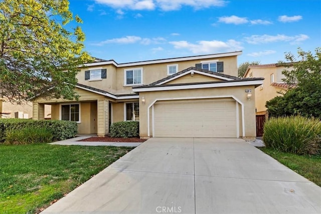 front of property with a front lawn and a garage