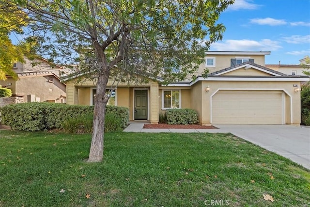 view of front property with a front lawn and a garage