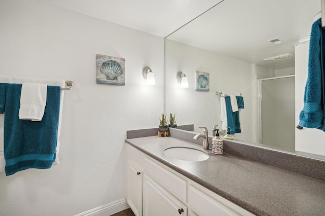 bathroom with vanity and an enclosed shower