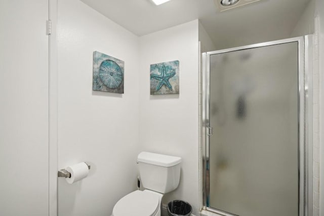 bathroom with toilet and walk in shower