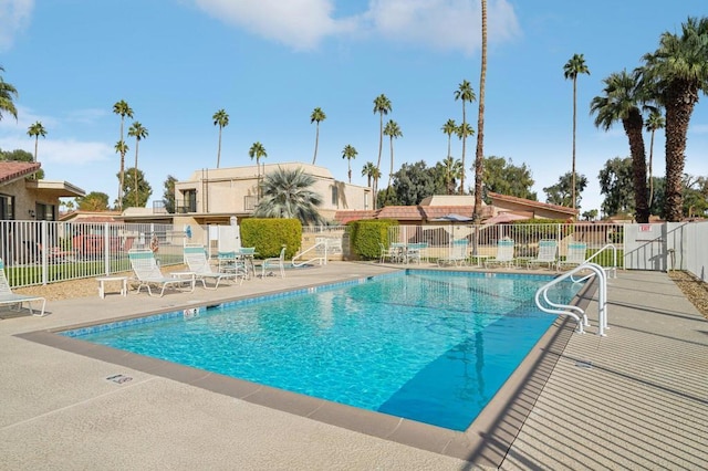 view of swimming pool with a patio area