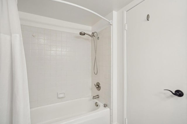 bathroom featuring shower / bath combo with shower curtain