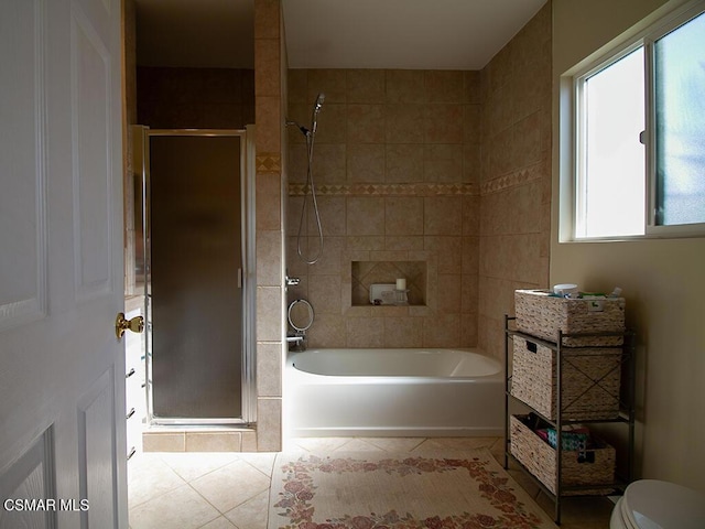 bathroom featuring tile patterned floors and independent shower and bath