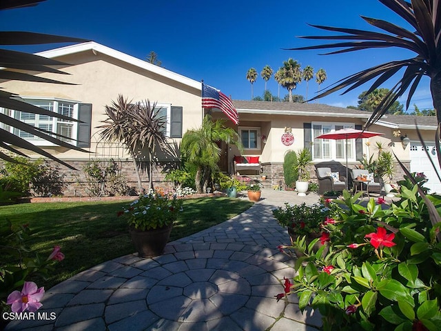 exterior space featuring an outdoor living space, a patio, and a yard