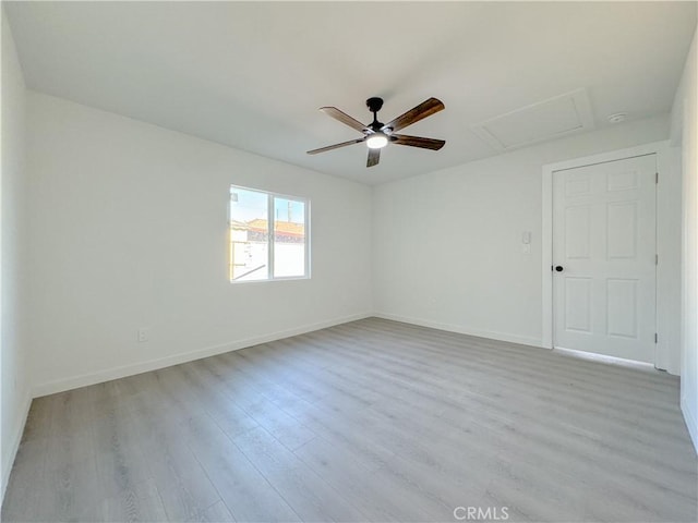 unfurnished room with ceiling fan and light hardwood / wood-style flooring