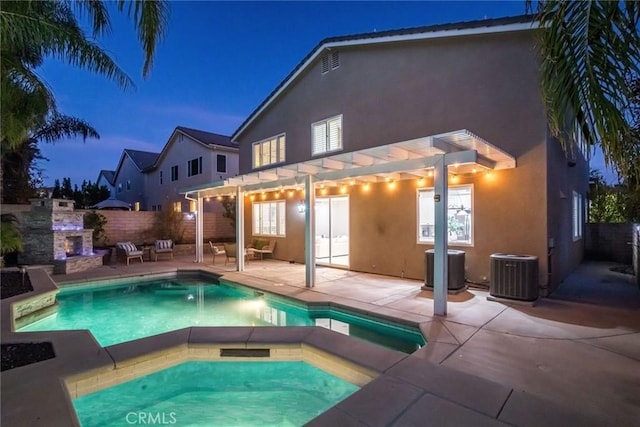 view of swimming pool featuring a pergola, an outdoor stone fireplace, central AC, a patio, and a hot tub