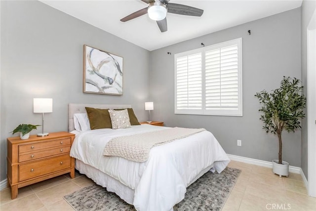 tiled bedroom featuring ceiling fan