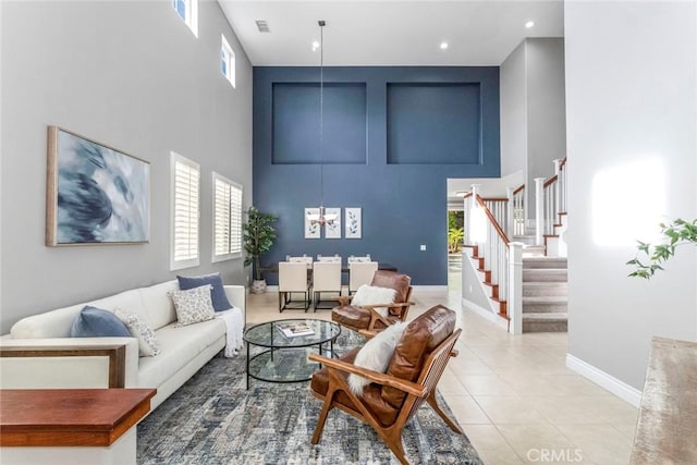 living room featuring a high ceiling and light tile patterned flooring