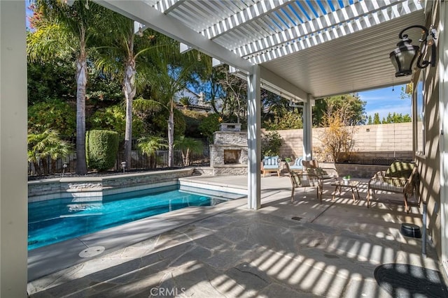 view of swimming pool with an outdoor living space with a fireplace and a patio area