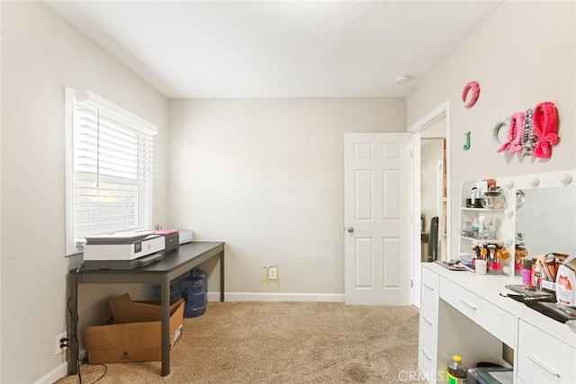 office area featuring light colored carpet