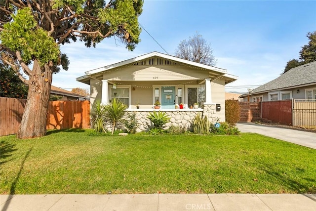 bungalow-style house featuring a front yard and a porch