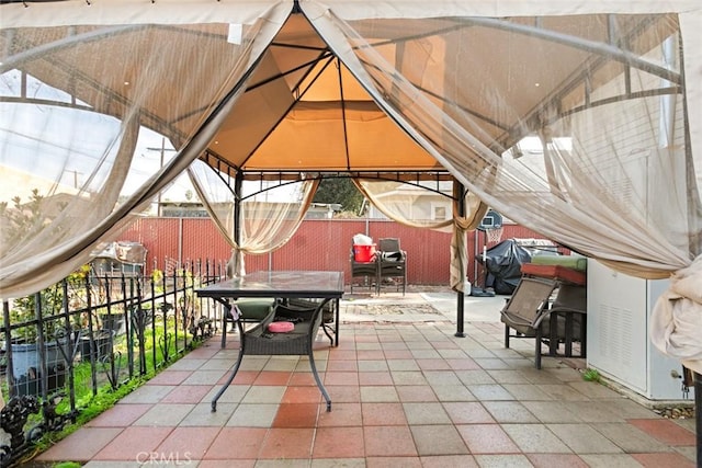 view of patio / terrace with a gazebo and a grill