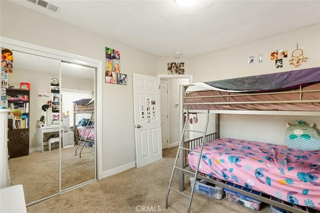 carpeted bedroom featuring a closet