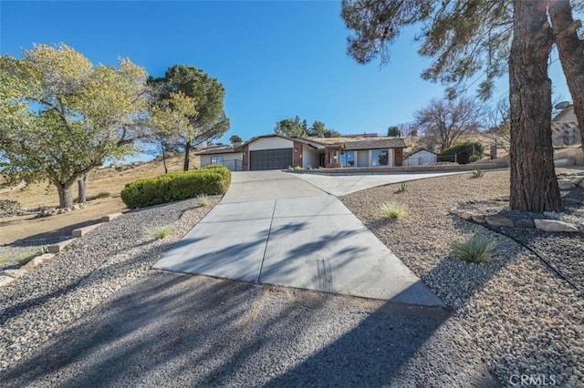 ranch-style home featuring a garage