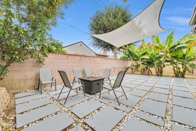 view of patio / terrace featuring a fire pit