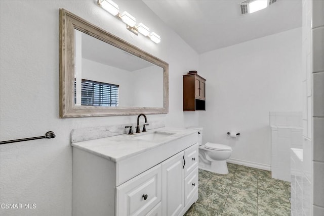 bathroom with tile patterned floors, vanity, and toilet