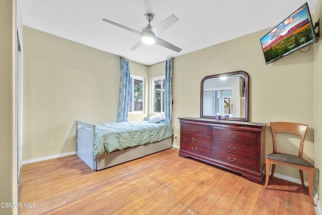 bedroom featuring ceiling fan and light wood-type flooring