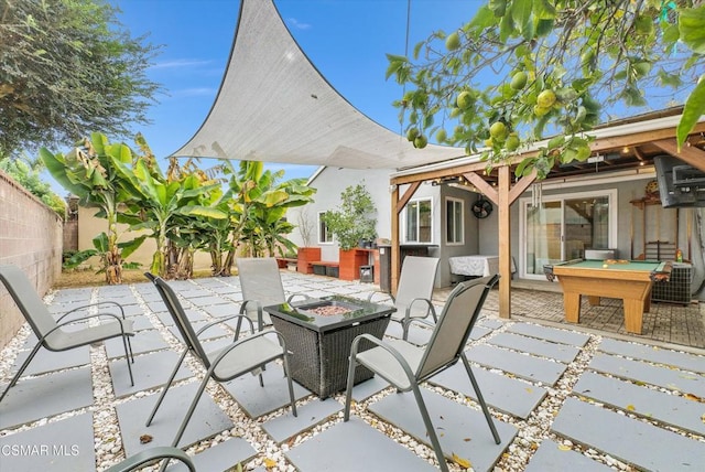 view of patio / terrace with an outdoor fire pit