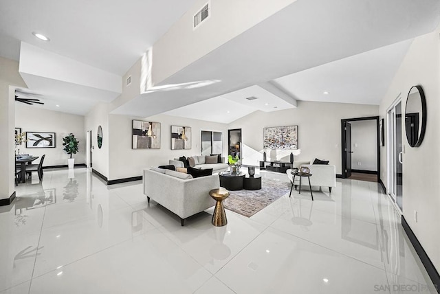 living room featuring vaulted ceiling