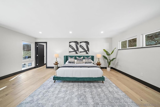 bedroom with light wood-type flooring