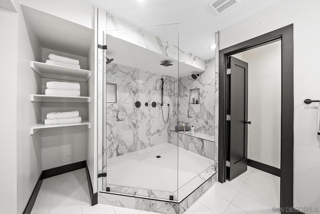 bathroom featuring a shower with door