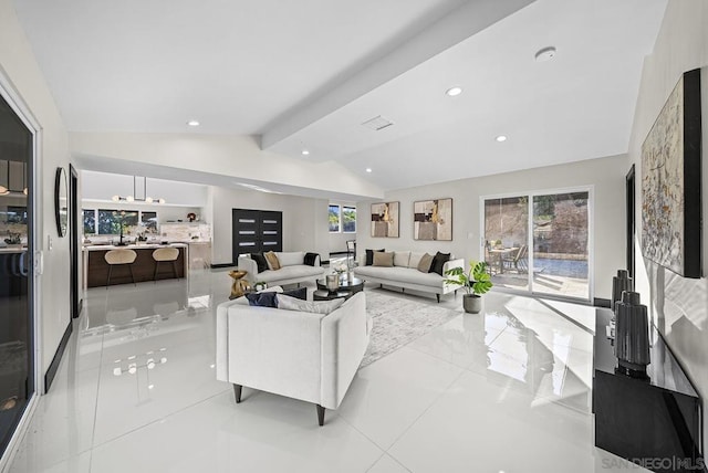 living room featuring lofted ceiling with beams and a wealth of natural light