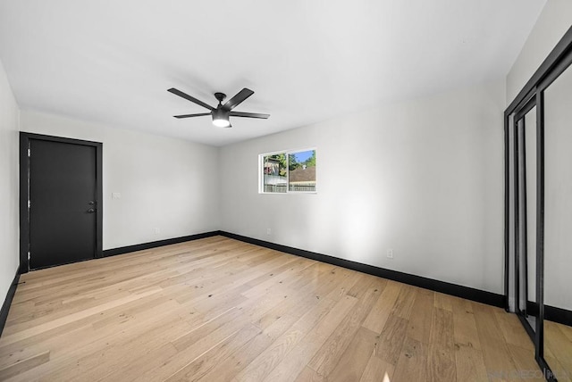 spare room with ceiling fan and light hardwood / wood-style flooring