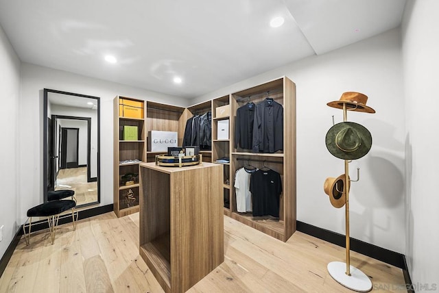 walk in closet featuring light hardwood / wood-style floors