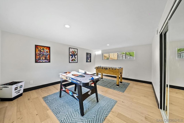 game room featuring light hardwood / wood-style floors