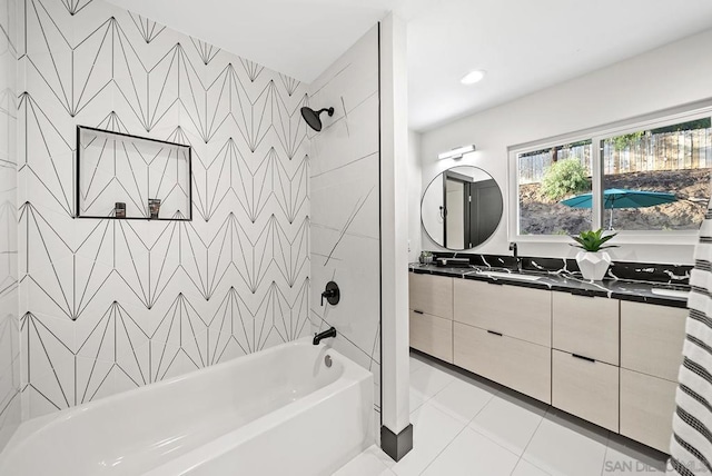 bathroom featuring vanity, tiled shower / bath combo, and tile patterned flooring