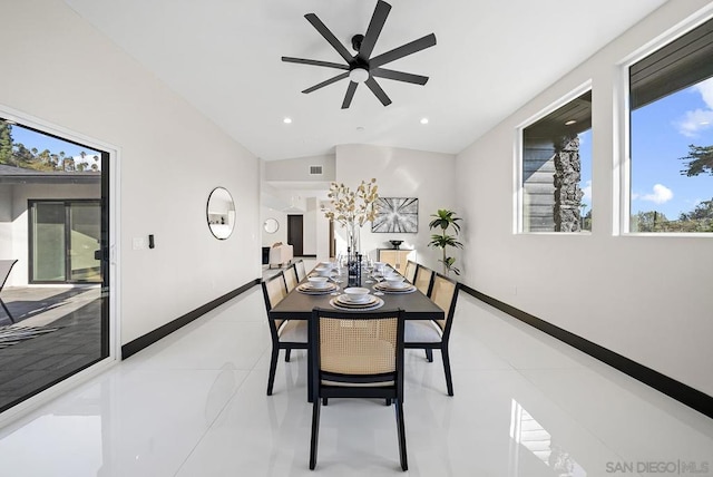 dining area featuring vaulted ceiling, a healthy amount of sunlight, light tile patterned floors, and ceiling fan