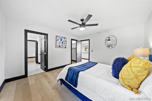 bedroom with ceiling fan and light hardwood / wood-style flooring