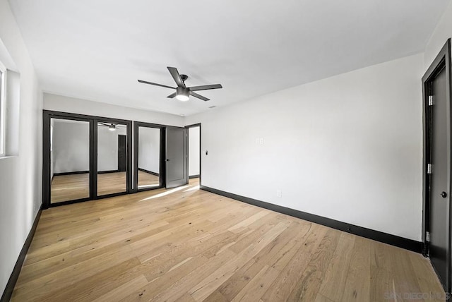 unfurnished bedroom featuring ceiling fan and light hardwood / wood-style floors