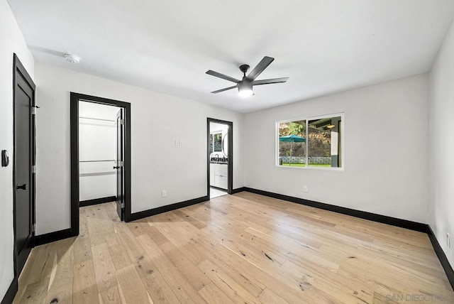 unfurnished room with light hardwood / wood-style flooring and ceiling fan