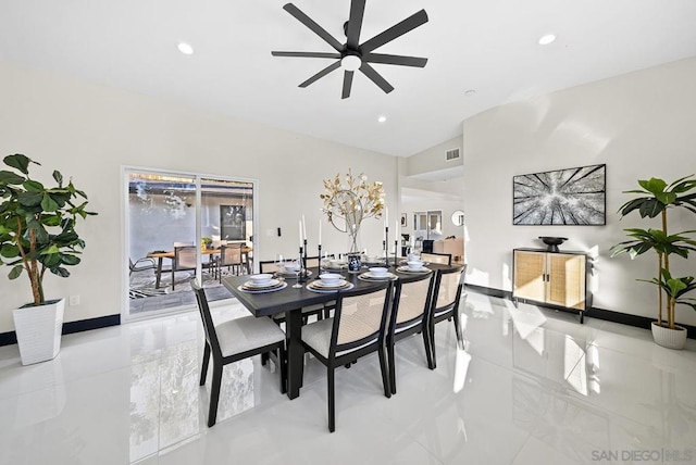 dining space featuring lofted ceiling and ceiling fan