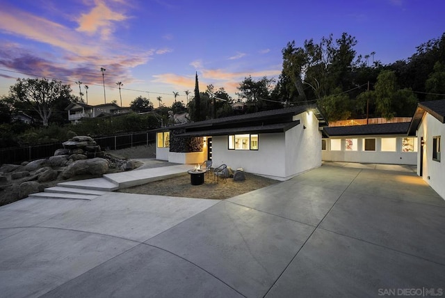 view of patio terrace at dusk