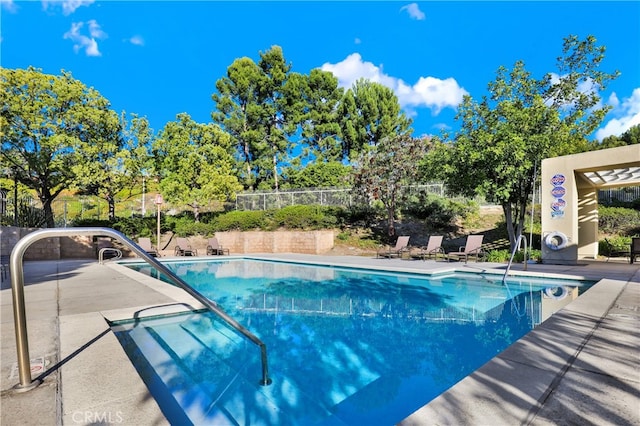 view of swimming pool with a patio