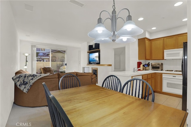 dining space with a notable chandelier