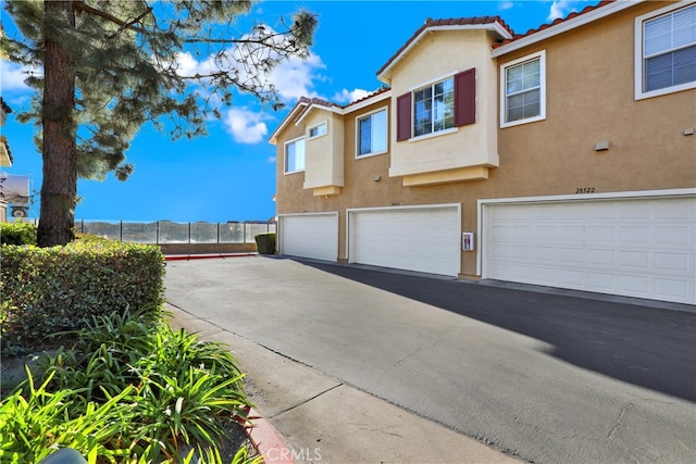 view of property exterior with a garage