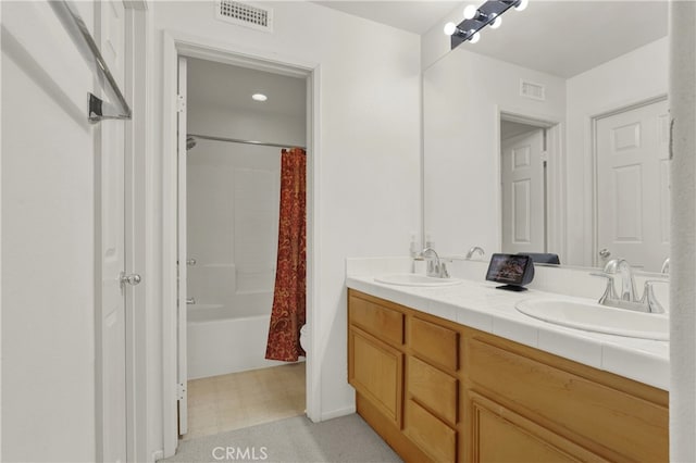 bathroom featuring vanity and shower / bath combination with curtain