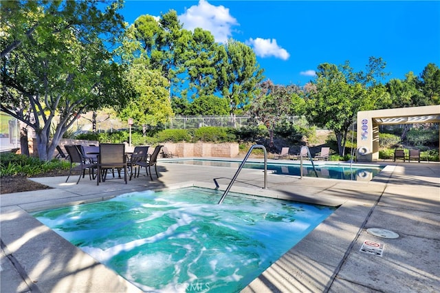 view of swimming pool featuring a patio area