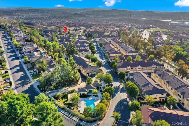 birds eye view of property with a mountain view