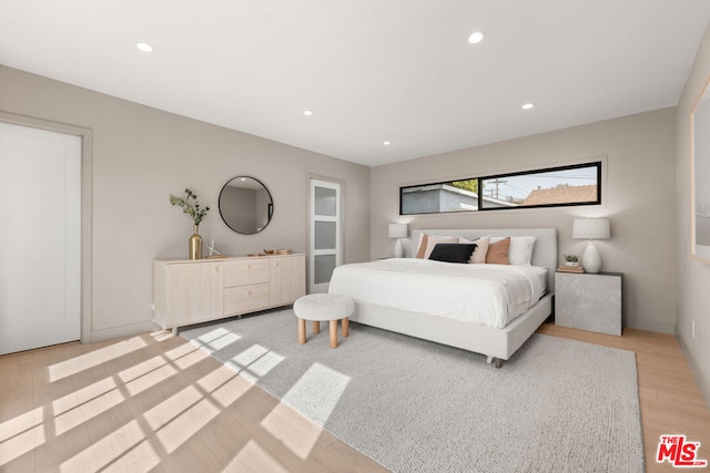 bedroom featuring light hardwood / wood-style floors