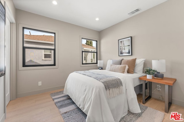 bedroom with light hardwood / wood-style floors